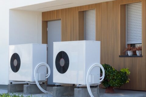 Heat pump installed outside a modern home – Triple-T