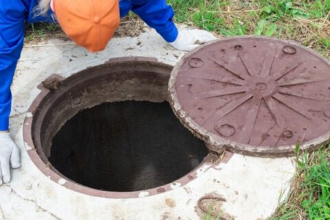 Man Checking the Septic Tank - Triple-T