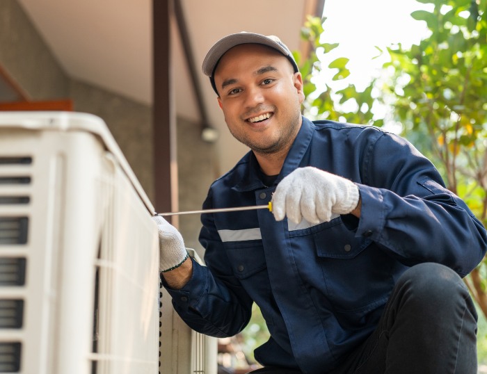 Man doing a HVAC Maintenance before Winter in Utah