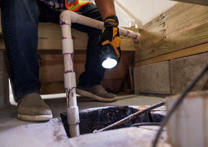 Technician Checking Sump Pit in Utah